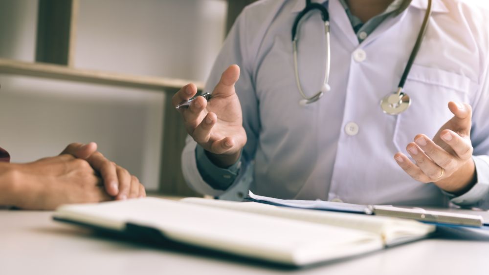 doctor consulting mature man